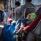 An Afghan family rides the tram between Krnjaca Refugee Camp to the center of Belgrade. Though young men are the most visible asylum-seekers in city parks, volunteers on-site say there is large number of families as well.